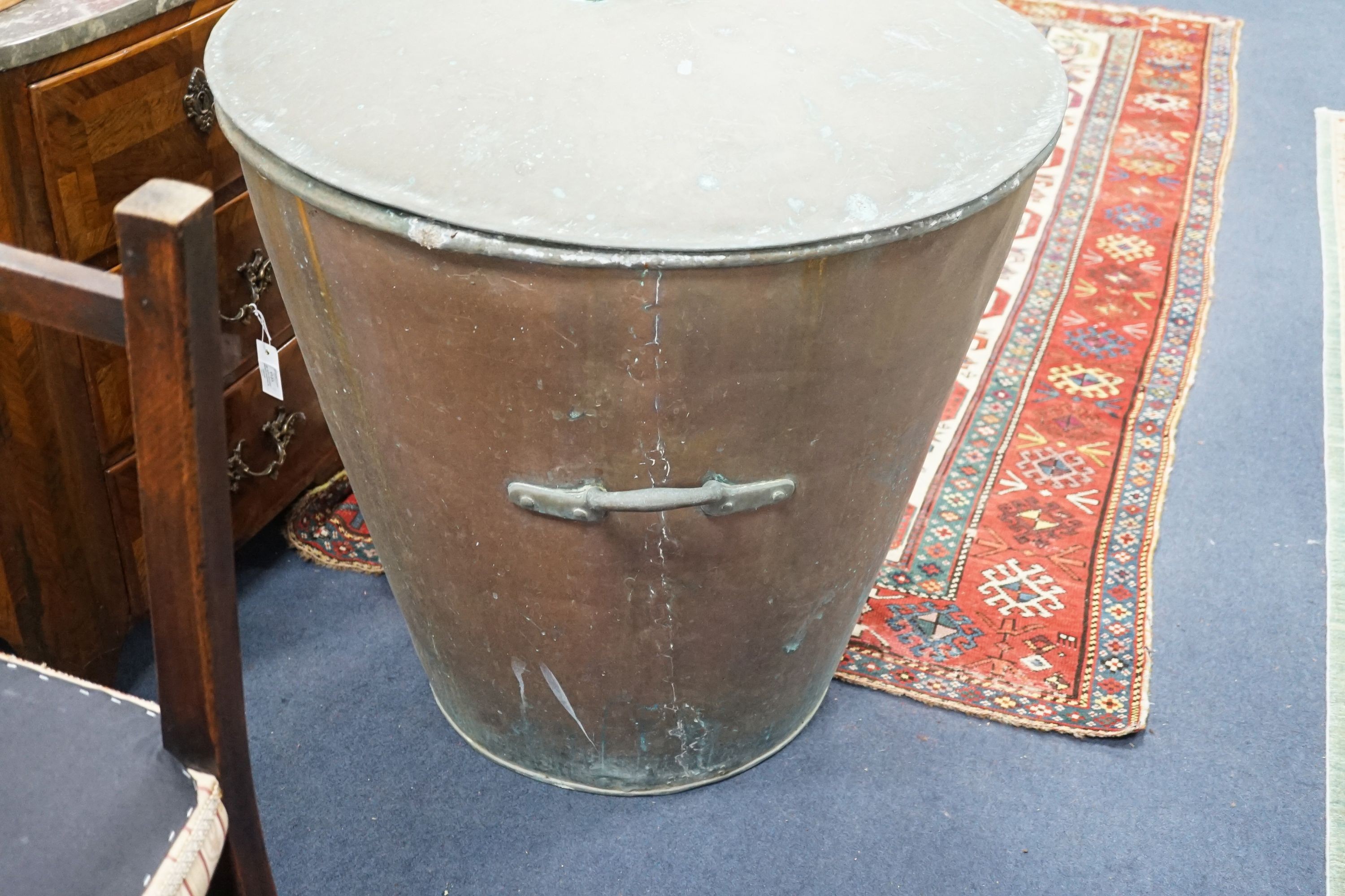 A large Victorian lidded copper vessel of tapering circular form, diameter 84cm, height 84cm